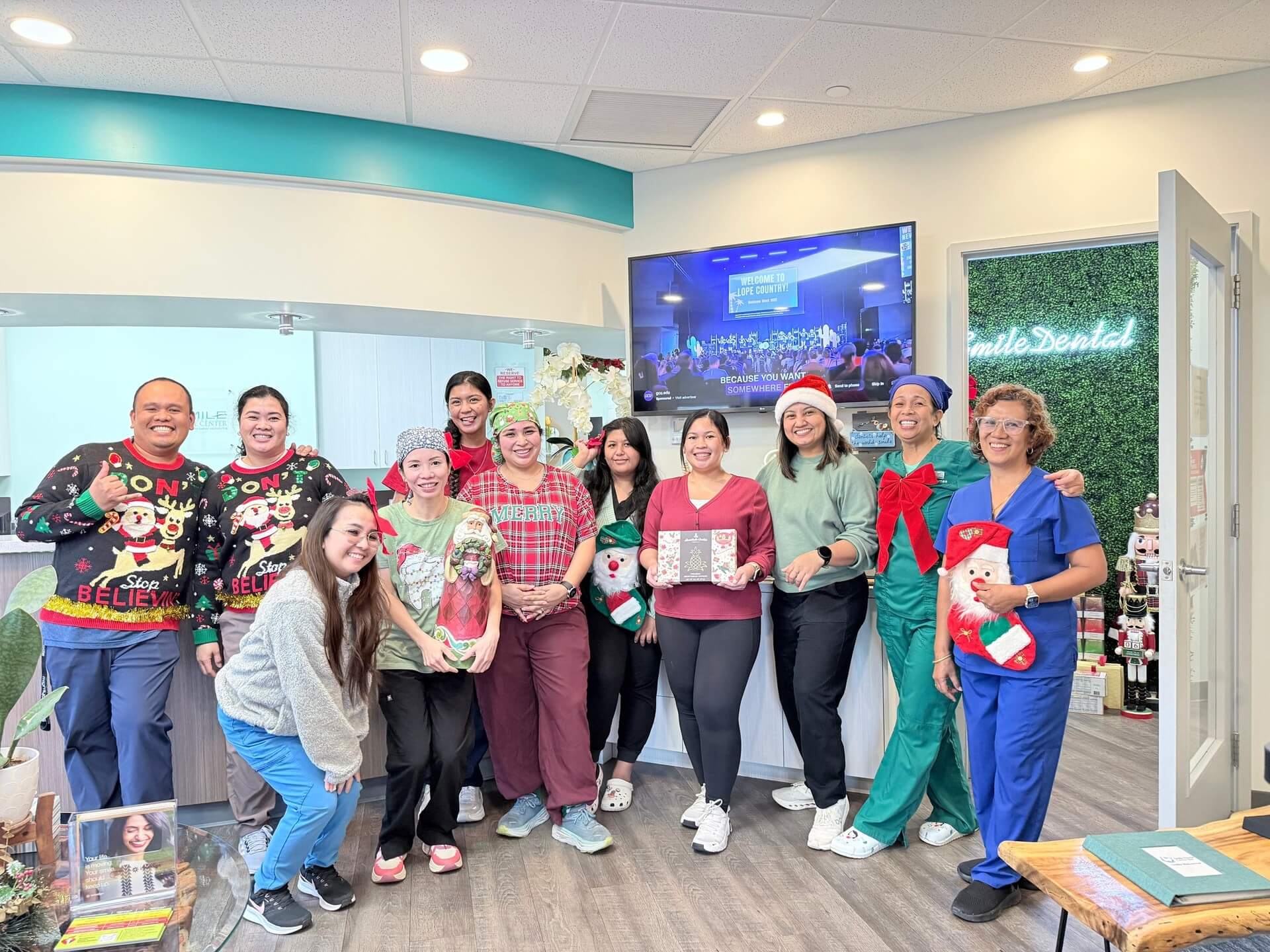 The Smile Dental Center team celebrating together at a holiday potluck