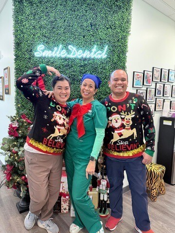The Smile Dental Center team in holiday sweaters