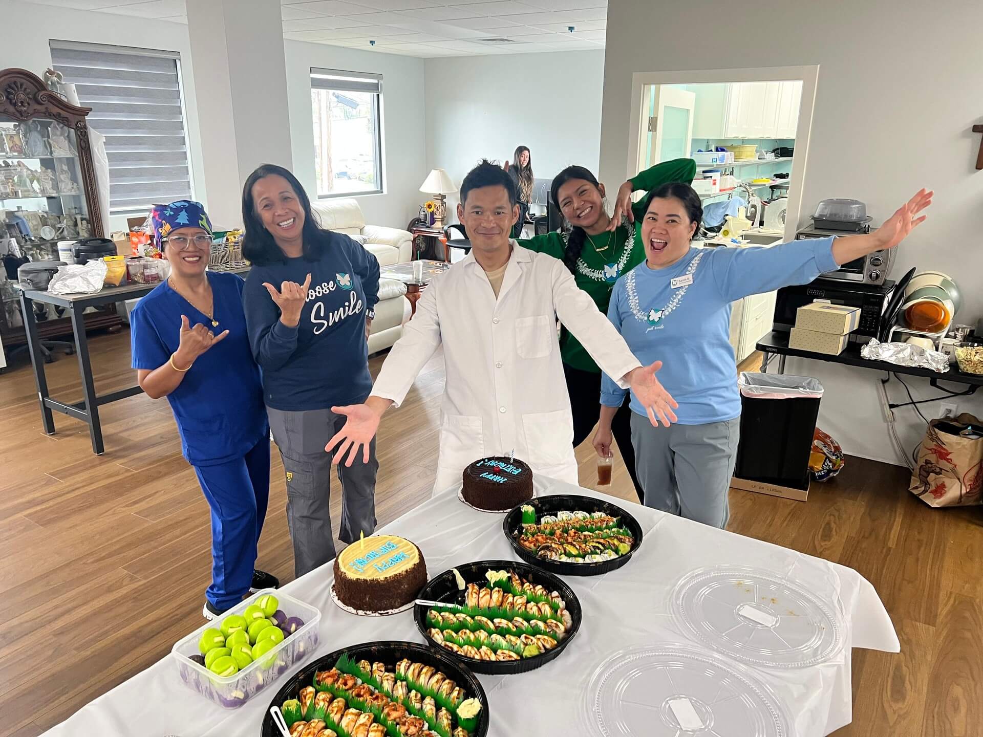 The Smile Dental Center team celebrating in the office