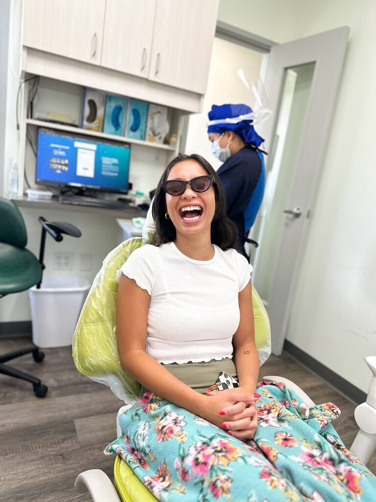 Happy patient laughing in the dental chair at Smile Dental Center