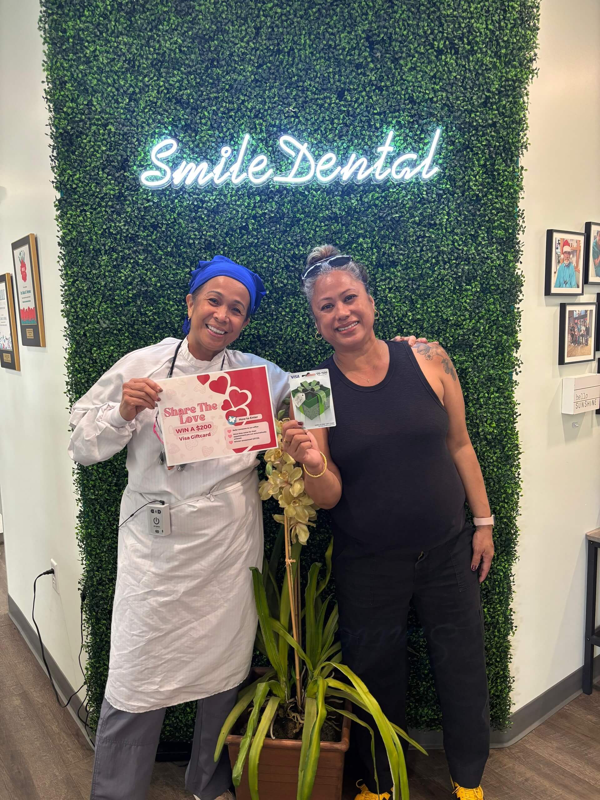 Patient at Smile Dental Center's anniversary wall
