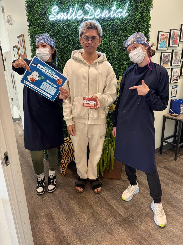 Patient gift-card winner at Smile Dental Center's Halloween event
