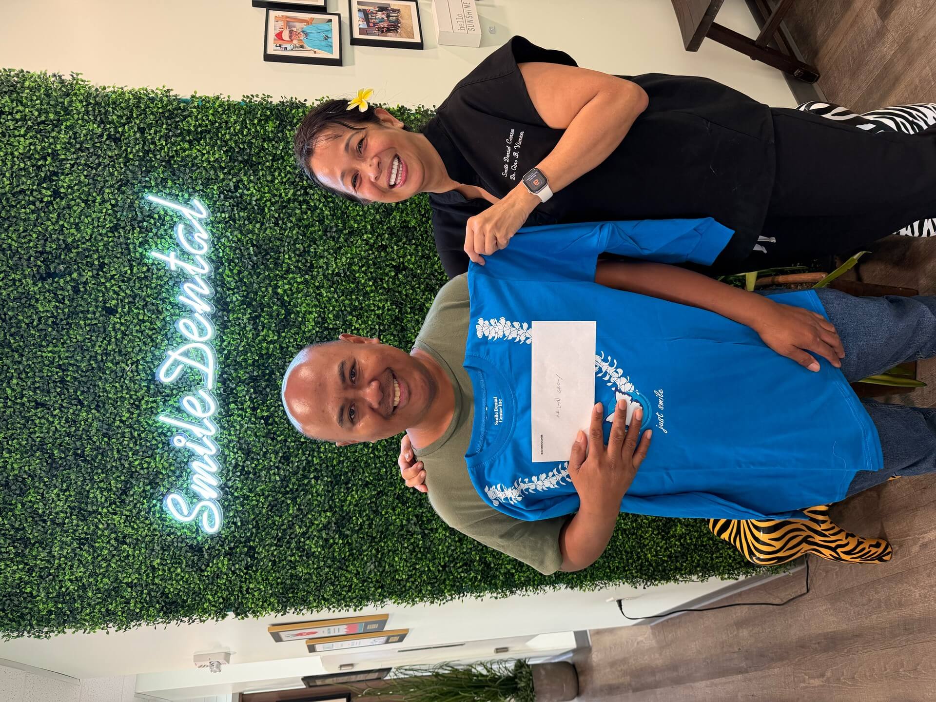 Patient receiving a Smile Dental Center shirt