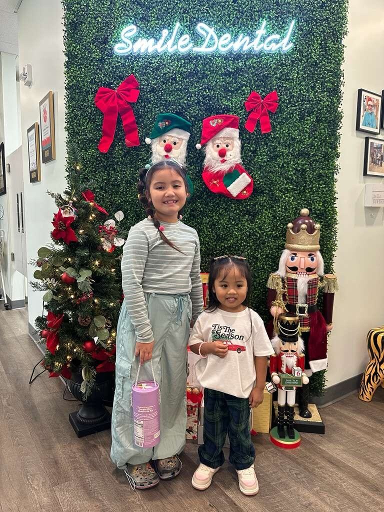 Young patients at Smile Dental Center's holiday wall