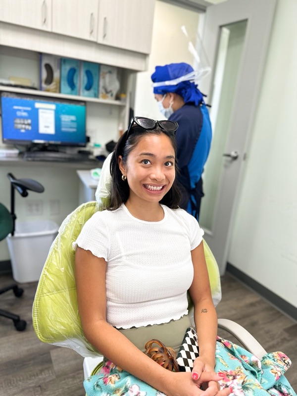 A happy patient smiling during her visit