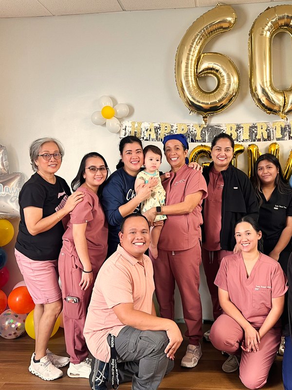 Our team celebrating together with balloons