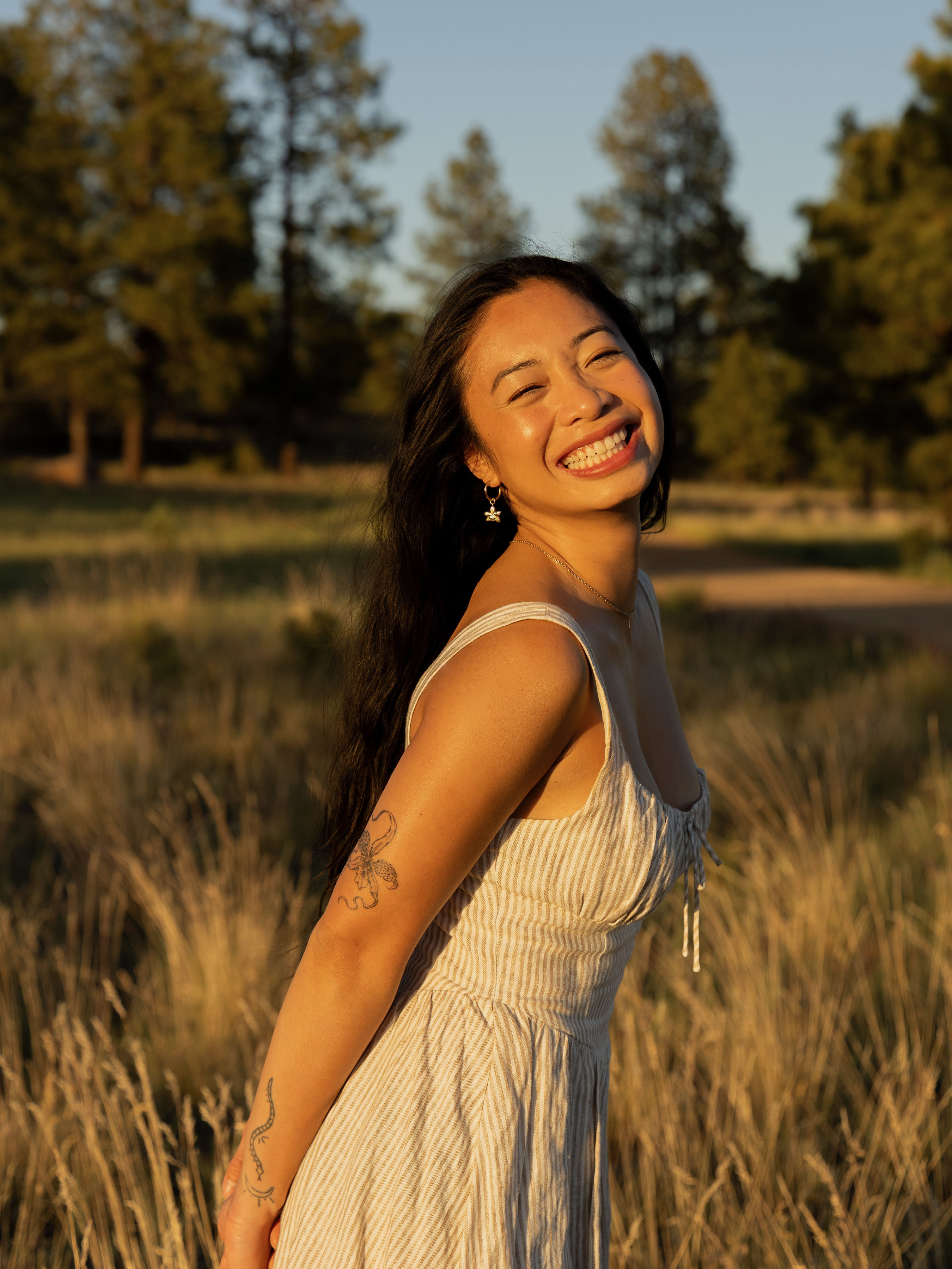 Jem smiling outdoors at golden hour, Smile Dental Center Waipahu