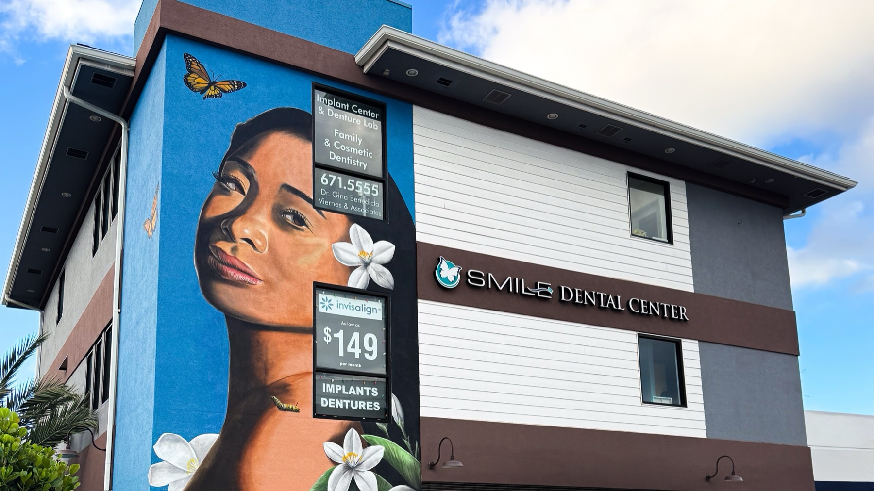 The finished Kamea Hadar mural on the side of Smile Dental Center in Waipahu, Hawaii